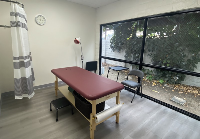 Professional acupuncture treatment room at Woori Acupuncture clinic in Riverside, California